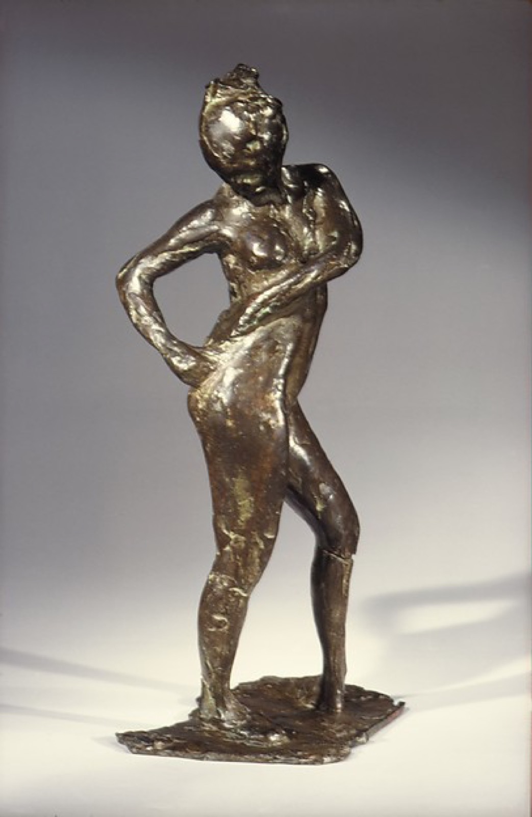Dancer Fastening the String of Her Tights